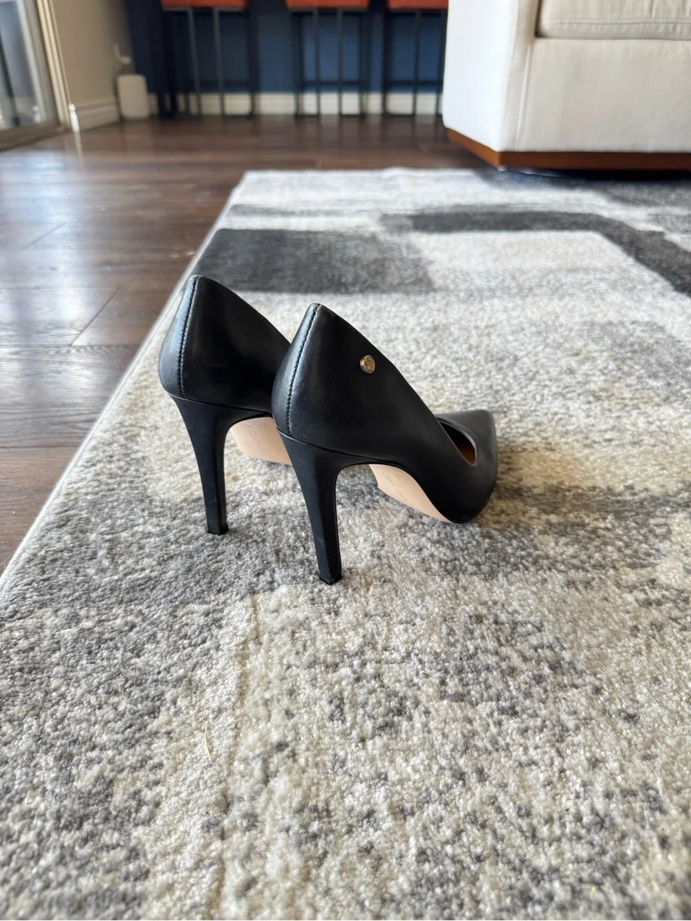 Calvin Klein Black Pointed-Toe Stiletto Pumps with Gold Accent